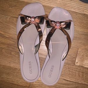 Guess rose gold bow flip flops